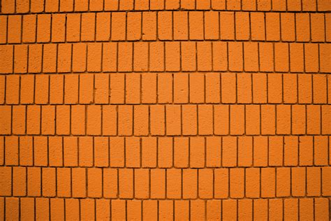 Bright Orange Brick Wall Texture With Vertical Bricks