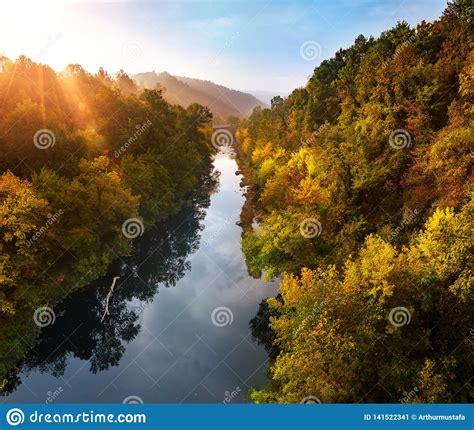 Magical Sunrise Over Deep Foggy Autumn Forest Along A River First Rays