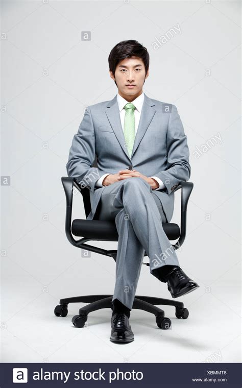 Person Sitting Cross Legged On Chair Man In Chair Man Crossing Legs