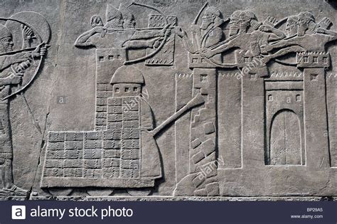 SIEGE TOWER AND BATTERING RAM IN ACTION ASSYRIAN ARMY DESTROYING THE