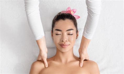 Face Lifting Massage Young Korean Woman Getting Beauty Treatments At Cosmetology Cabinet Stock