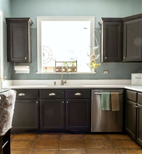 Flip over cabinets to spray the face of the cabinets. How To Paint Builder Grade Cabinets