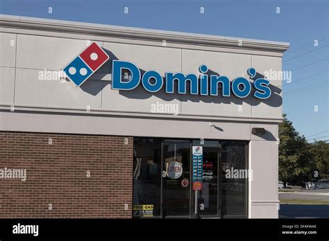Merrillville - Circa October 2022: Domino's Pizza Restaurant. Domino's