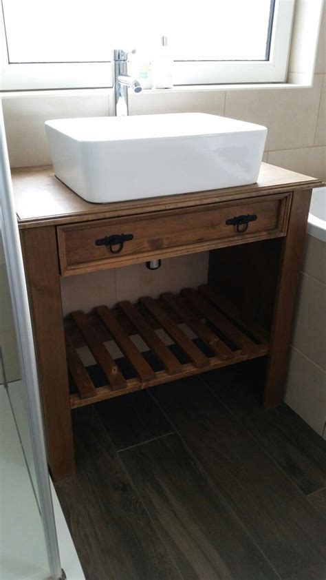 Freestanding Rectangular Sink On The Top Of Wooden Unit