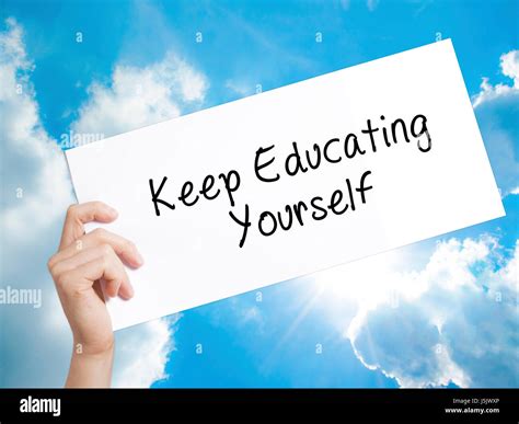 Keep Educating Yourself Sign On White Paper Man Hand Holding Paper