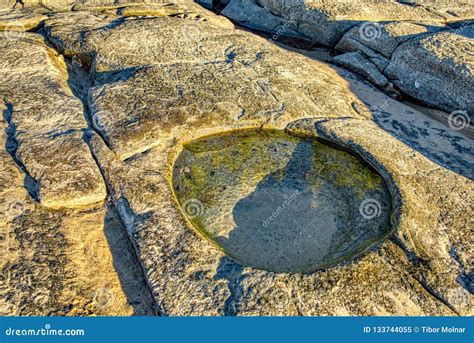 Water Hole In Aged Old Rock Natural Erosion Coastline Queensland