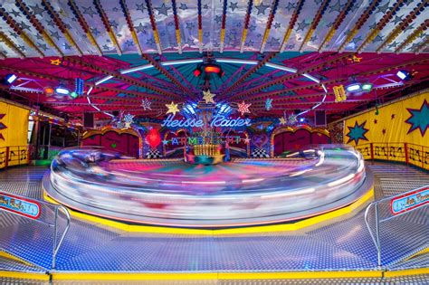 leisure 4k carnival built structure illuminated rides fairground spinning amusement park