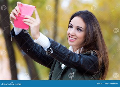 beautiful girl taking a selfie in autumn stock image image of cell human 47811395