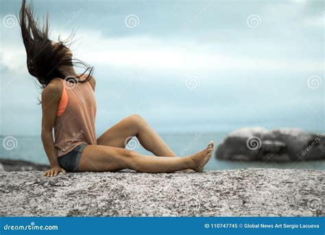 Woman Flicking Her Hair On A Rock At Sunset On Bakovern Beach Cape Town Stock Image Image Of