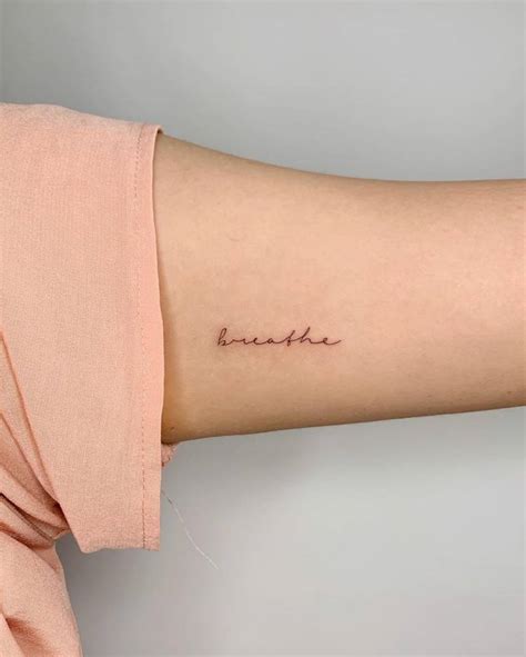 Breathe Lettering Tattoo On The Inner Arm