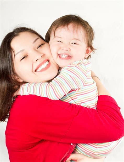 Happy Mom And Baby Girl Laughing Happy Mom And Baby Girl Hugging And