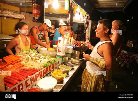Environmental Portrait Of Carnival Dancer In Costume At Street Food