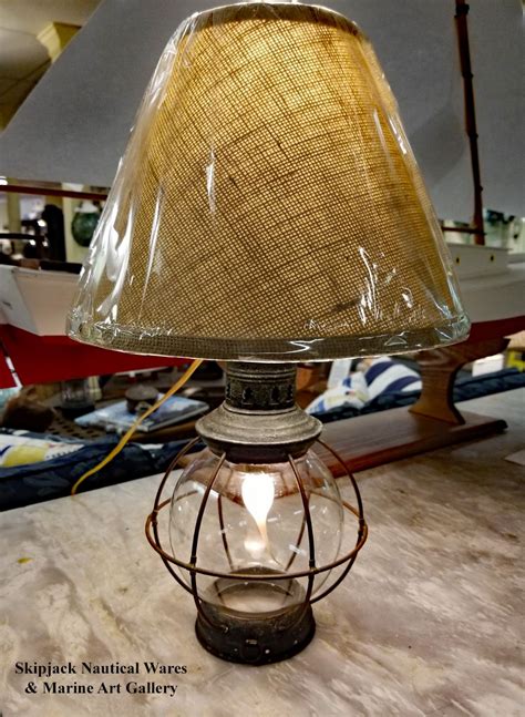 This is a charming vintage nautical lamp. Early 20th Century Globe Lantern Nautical Table Lamp ...
