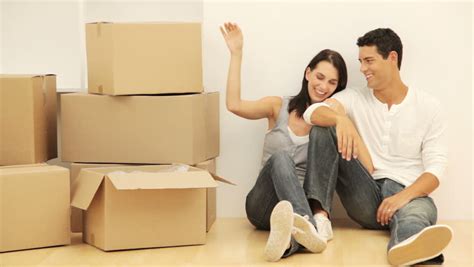 Young Couple With Moving Boxes Stock Footage Video 100 Royalty Free