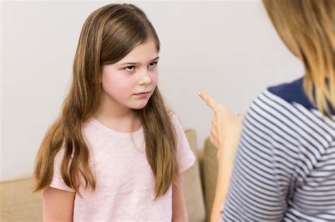 Mother Scolding Her Daughter In Living Room Photo Free