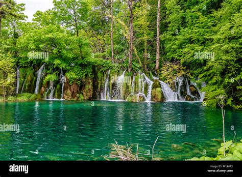 Waterfall And Lake At Plitvice National Park Located In Both Lika