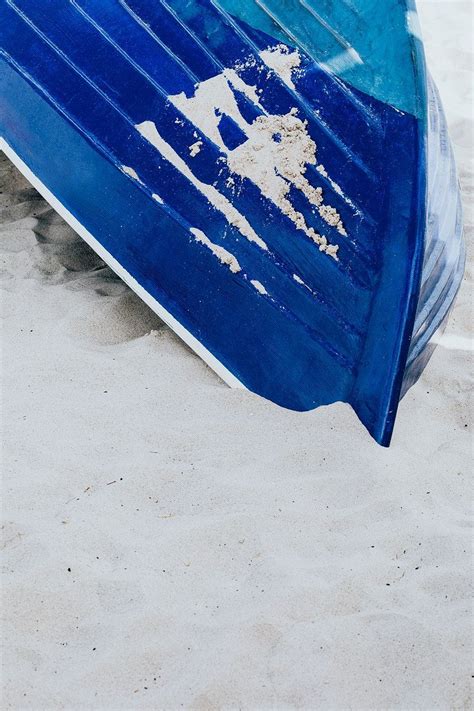 Blue Boat Lying In The Sand On A Beach Free Image By