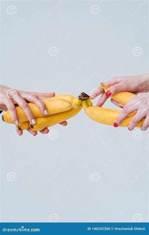 Two Pairs Of Hands Holding A Few Bananas Stock Photo Image Of Flesh