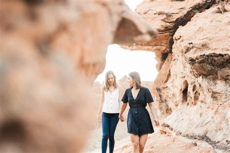Engagement Photos On Red Rock Sandstone Cliffs Of Snow Canyon