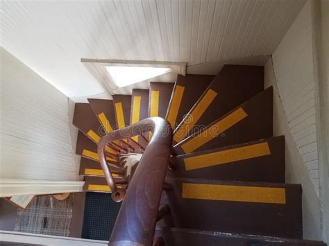 Brown Irregular Steps And Banister And Yellow Lines In Lighthouse