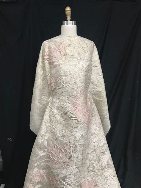 The label 'designer fabric' can mean a fabric that has been printed with a unique design made specifically for or by a particular designer, or one that has been chosen (in specific colorways) from a textile company's collection for a particular fashion house. Haute Couture Gold Lame Brocade — Mendel Goldberg Fabrics ...