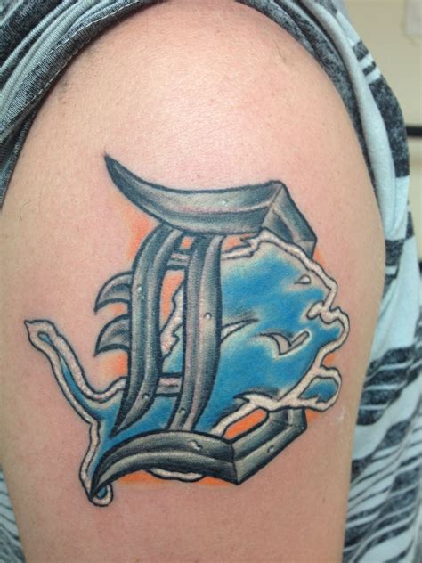 Located in green bay, wi, we serve clients in the. My Detroit Lions/Tigers tattoo | Lion tattoo design ...