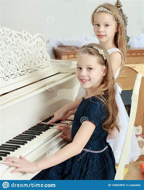 Girls Twins Playing The Piano Stock Image Image Of