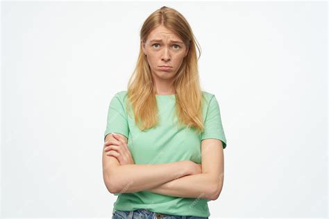 Premium Photo Sad Upset Woman With Freckles In Mint Tshirt Keeps Arms