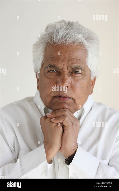 Close Up Of A Man Resting Chin On Hands Stock Photo Alamy