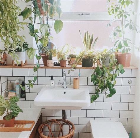 Greenery and plants provide a great way to transform a mundane space into a zen oasis. free people plant bathroom aesthetic | Bohemian bathroom ...