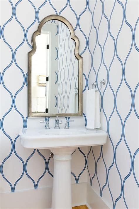 Silver Arch Powder Room Mirror Over A White Pedestal Sink Display