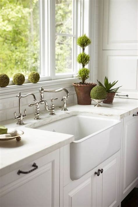 Many styles are deep enough to keep dishes concealed from view. Caden Design Group: White kitchen with farmhouse sink with ...