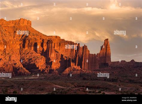 Stormy Clouds At Sunset Over Wray Mesa And The Fisher Towers With The
