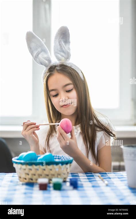 Cute Little Girl Painting Egg For Easter Closeup Stock Photo Alamy