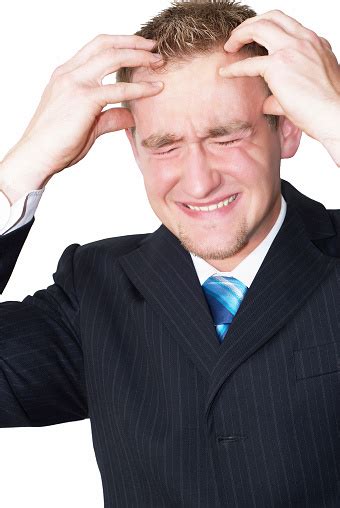 Young Blonde Businessman Has Headache And Is Burned Out Stock Photo