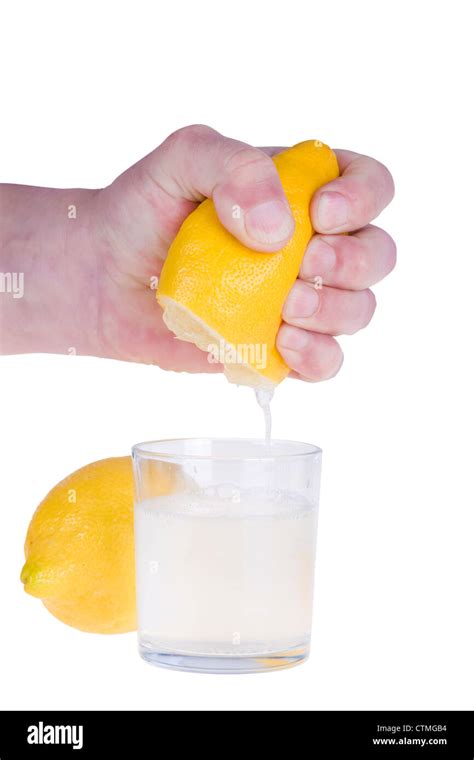 Squeezing Lemon On White Background Stock Photo Alamy