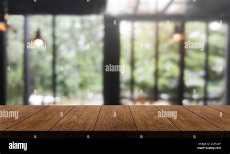 Wood Table In Blur Background Of Modern Restaurant Stock Photo Alamy