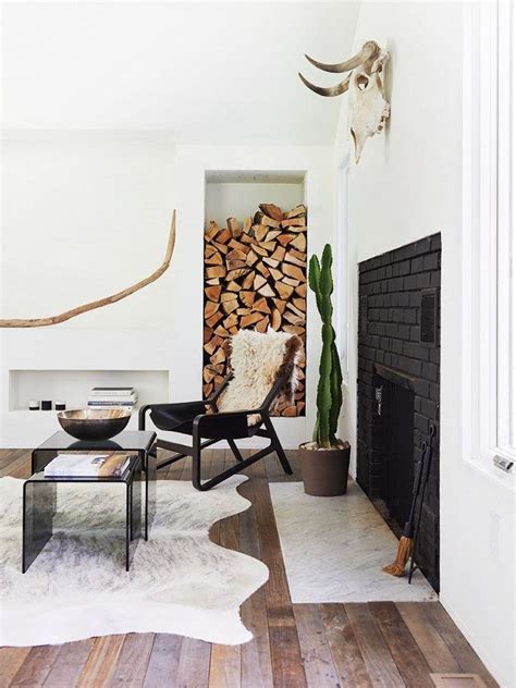 Scandinavian Living Room Design With Cowhide Rug On Thou Swell