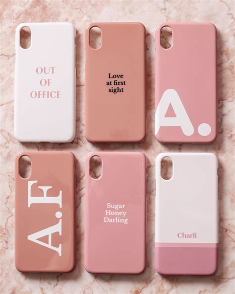 Four Iphone Cases With The Same Name On Them All In Pink And White Colors