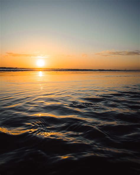 Sunset Water Waves Sun Dusk Hd Phone Wallpaper Peakpx