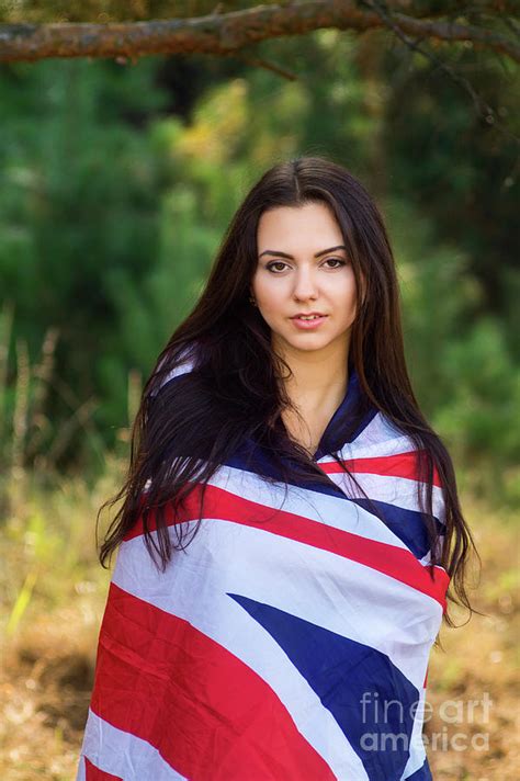 Young Beautiful Brunette Girl Posing With A British Flag In Autumn Park