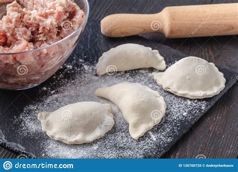 Dumplings Raw On A Wooden Board Traditional Homemade Food Stock Photo