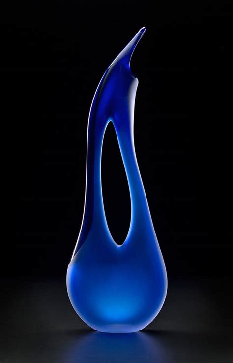 The Tall Blue Avelino Glass Sculpture Contains A Small Element Of Opaque Blue Colored Glass That