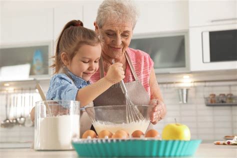 Cute Girl And Her Grandmother Cooking Stock Photo Image Of Caucasian