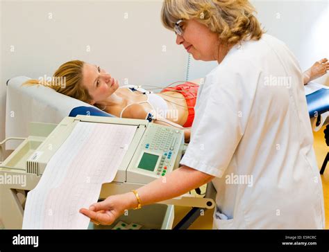 Woman Undergoing An Electrocardiography Ekg Examination Department