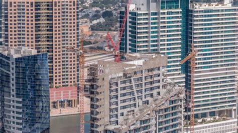 High Multi Storey Buildings Under Construction And Cranes Timelapse