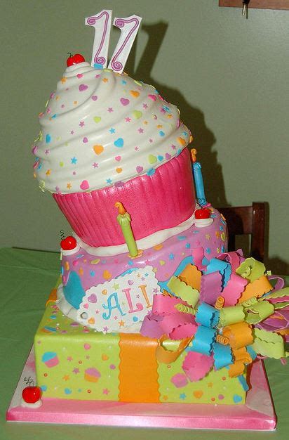 Maybe you would like to learn more about one of these? 3 tier birthday cake for 11-year-old with giant cupcake on ...