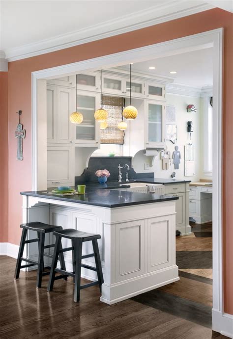 A connected kitchen and dining area make for easy serving. A kitchen peninsula is a great addition to an open kitchen ...