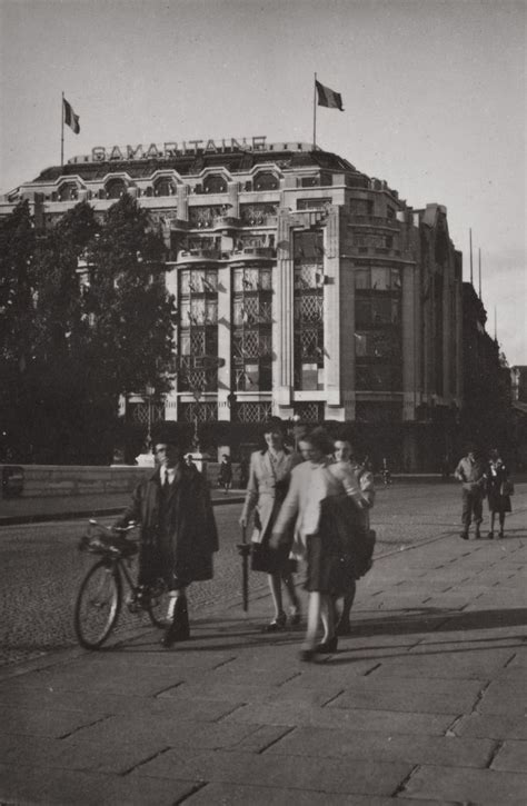 Is a iconic la samaritaine department store in the city of paris, france, founded in the nineteenth century. 1940s World War II snapshot photo of Pedestrians near the ...