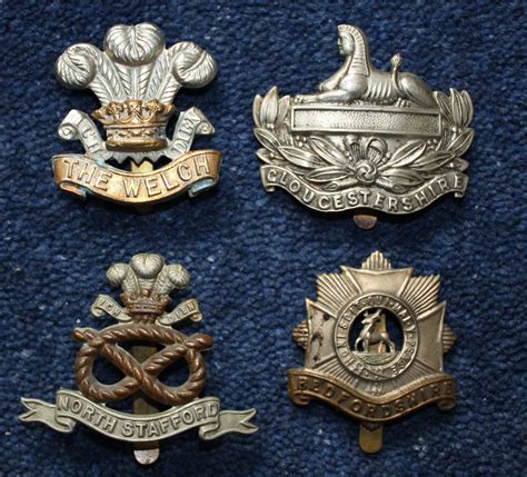 WW1 Four (4) British Army Regimental Cap Badges. in Helmet & cap badges
